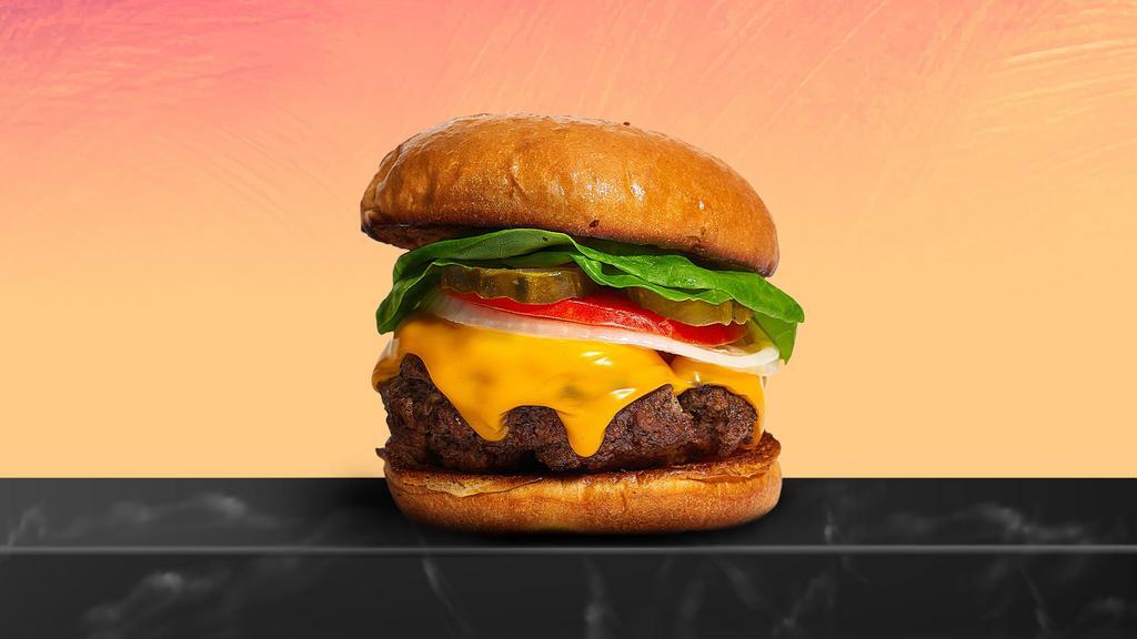 Cheesy But Grate Burger · Taste the American Dream with our juicy American beef patty cooked medium and served on griddled brioche buns with cheddar cheese, ketchup, mayo, red onions, pickles, and green leaf lettuce.