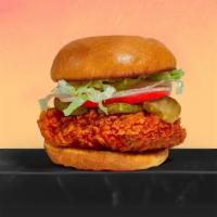 Hot in Nashville Fried Chicken Sandwich · Hot stuff. Crispy fried chicken, sliced tomatoes, shredded lettuce, dill pickles, Nashville ...
