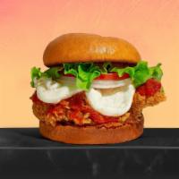 Oh Parm Me Some Chicken! · Best of the barnyard - chicken Parmesan sandwich topped with mozzarella cheese and marinara ...