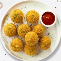 Fried Mac & Cheese Balls · Freshly fried mac and cheese balls served with classic cheese sauce for dipping