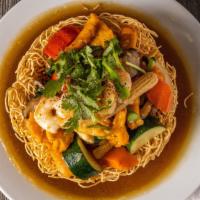 57. Bird's Nest Noodle · Mi Xao gion. Crispy egg noodle with sautéed vegetable, onion, chicken and shrimp in gravy.