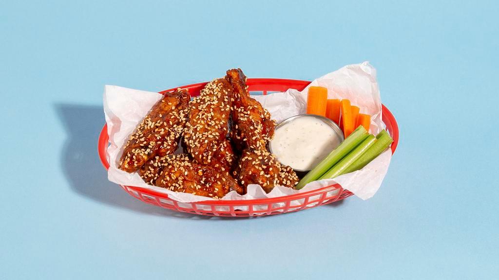 Fried Korean Chicken Wings · (6) Bone-in wings drenched in house sweet spicy sauce, tossed with sesame seeds, scallions and served with dipping sauce.