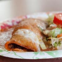 Enchiladas · Corn tortillas stuffed with your choice of meat or cheese topped with melted cheese.