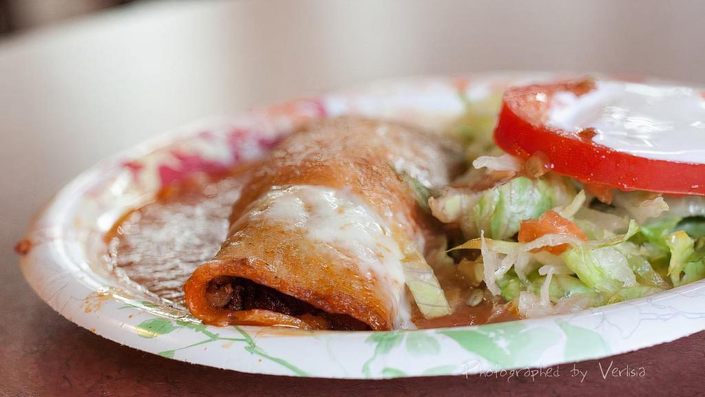 Enchiladas · Corn tortillas stuffed with your choice of meat or cheese topped with melted cheese.