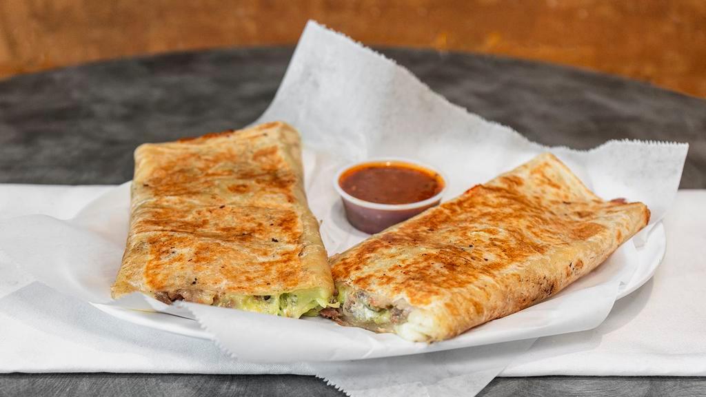 Super Quesadilla · Flour tortilla with any meat, guacamole, sour cream, cheese and salsa.