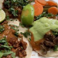 34. Vampiros (Tacos) · Melted jack cheese, meat, onions, cilantro, guacamole, and red salsa.
