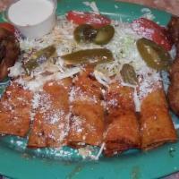 8. Enchiladas Michoacanas (5) · Red enchiladas with oregano, onions, vinegar, Mexican grated cheese, green cabbage or lettuc...