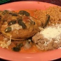 15. Chile Relleno · Mild poblano chili stuffed with Mexican cheese, covered with scrambled egg, and ranchero sau...