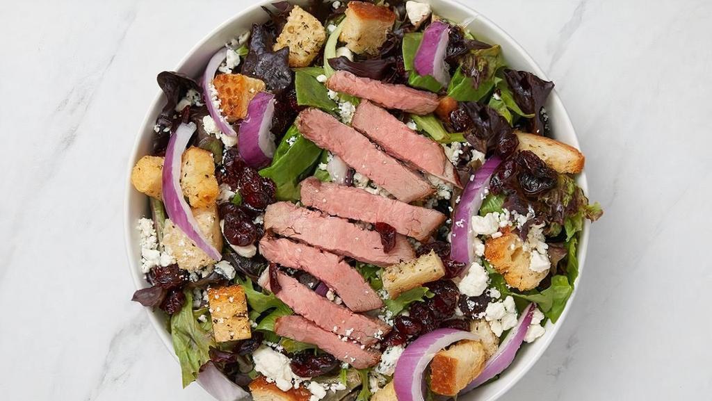 Steak Salad · Chargrilled tri-tip, mixed greens, crumbled blue cheese, sun-dried cranberries, rosemary croutons, red onion with balsamic vinaigrette.