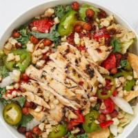 Santa Fe Chicken · Chargrilled chicken, romaine & arugula, grilled corn, spiced chickpeas, fire-roasted red bel...