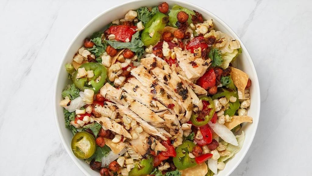 Santa Fe Chicken · Chargrilled chicken, romaine & arugula, grilled corn, spiced chickpeas, fire-roasted red bell pepper, jicama, pickled jalapeno, tomato and tortilla strips with cilantro lime dressing.