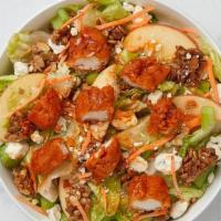 Spicy Buffalo Salad · Two buffalo chicken strips, romaine, carrots, fuji apples, celery, Bleu cheese crumbles with...