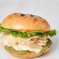 Pesto Chicken · Chargrilled chicken, basil pesto, smoked provolone, caramelized onions, leaf lettuce, on a c...