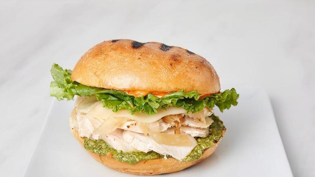 Pesto Chicken · Chargrilled chicken, basil pesto, smoked provolone, caramelized onions, leaf lettuce, on a ciabatta roll with sun-dried tomato aioli.