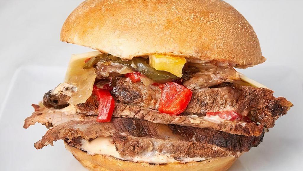 California Cheese Steak · Chargrilled tri-tip, pepper jack cheese, sautéed mushrooms, roasted peppers and onion mix, and spicy aioli on a Ciabatta roll.