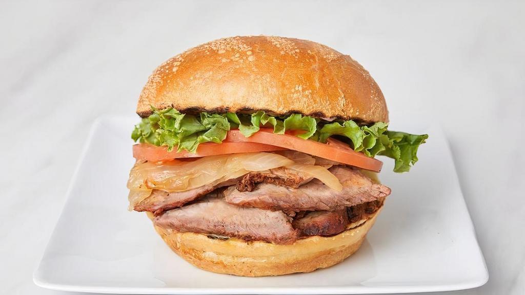 Classic Tri Tip · Jack's Classic Tri-Tip sandwich includes caramelized onions, leaf lettuce, tomato, mayo, and honey mustard on a fresh-baked sourdough roll.