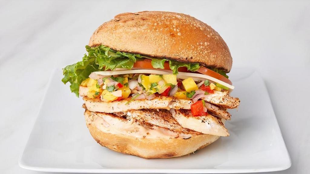 Cajun Chicken · Blackened chicken breast, Swiss cheese, leaf lettuce, tomato, and chipotle mayo, topped with mango salsa on a sourdough roll.