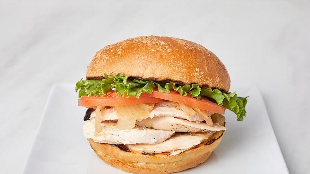 Classic Chicken · Jack's Classic Chicken sandwich includes caramelized onions, leaf lettuce, tomato, mayo, and honey mustard on a fresh-baked sourdough roll.