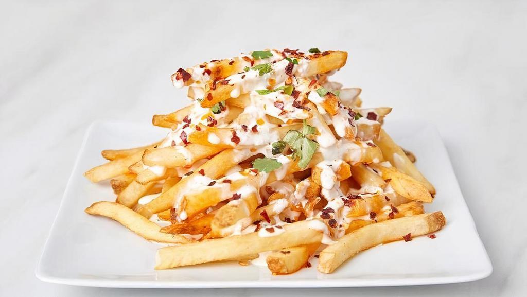 Urban Fries · Fries with a spicy chili oil, Bleu cheese dressing and chili flakes.
