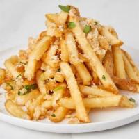Garlic Fries · Fries with roasted garlic and Parmesan cheese.