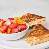 Kids Grilled Cheese · Served with a side. Choose from sliced fresh fruit, fries or a side salad with mixed greens ...