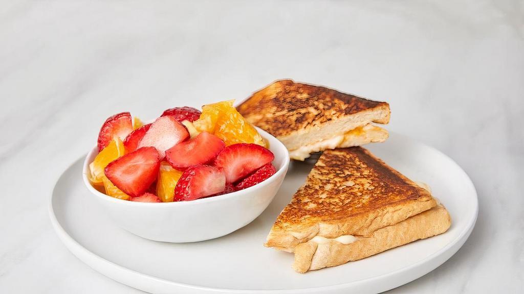 Kids Grilled Cheese · Served with a side. Choose from sliced fresh fruit, fries or a side salad with mixed greens and carrots.