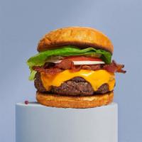 Bacon Bandit Burger · American beef patty topped with melted cheese, layers of crispy bacon, lettuce, tomato, onio...