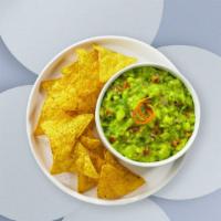 Shout For Guac & Chips  · A heaping scoop of fresh guacamole and warm tortilla chips
