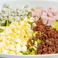 Protein Cobb Salad · Butter lettuce, avocado, hard-boiled egg, crispy bacon, diced ham, crumbled bleu, and white ...