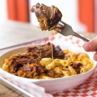 The Drunken Pig · The basic topped with double serving of slow-roasted barbecue pulled pork.