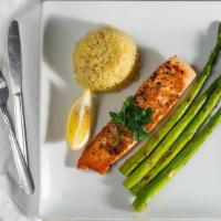 Atlantic Fresh Salmon · Served with grilled asparagus and rice pilaf, roll and butter.