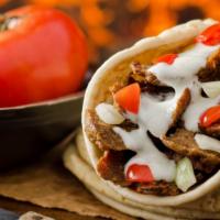 Beef Gyro Wrap · Classic mediterranean style beef gyro with lettuce, tomatoes, onions, tzatziki sauce on pita...