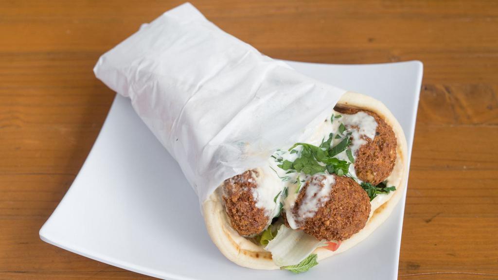 Vegetarian Gyro · Chef's special falafels made with grilled onions, peppers, mushrooms, lettuce, tomatoes, olives and tzatziki sauce on warm pita bread.