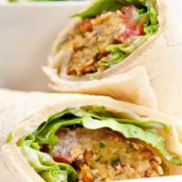 Spicy Falafel Wrap · Chef's fresh made falafel balls mixed with spices, hummus, lettuce, tomatoes, onions and tah...