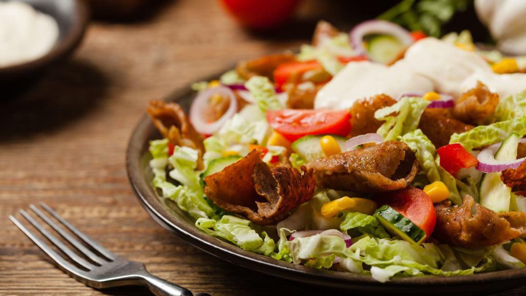 Combo Salad · Mix of beef and chicken shawarma with greek salad and feta cheese.