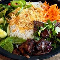 Grilled Beef Short Rib Bowl · Grilled beef short rib, your choice of base, toppings, optional add-ons and sauce.