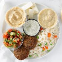 Vegetarian Combo Platter · Vegetarian, gluten-free, without pita. Rice pilaf, falafel, garlic hummus, tomato-cucumber s...