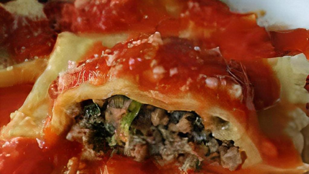 Meat Ravioli · Tender pasta squares filled with beef, special herbs & Mozzarella cheese.