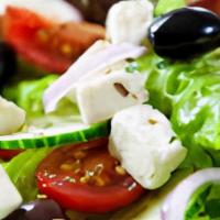 Greek Salad · Crisp lettuce, tomatoes, red onions, red cabbage, pepperoncini, black olives & Feta cheese.