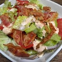 Bacon Salad · Crisp lettuce, tomatoes, red onions, red cabbage, pepperoncini, black olives, mozzarella, ch...
