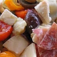 Antipasto Salad · Crisp lettuce, tomatoes, red onions, red cabbage, pepperoncini, black olives, Mozzarella, Ch...