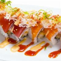 Snow Dragon · Crab meat with tempura shrimp topped with tuna, salmon, crabmeat