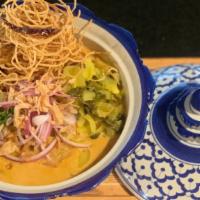 Khao Soi · Northern style Thai curry egg noodle soup red onion, pickled with boiled egg with tofu