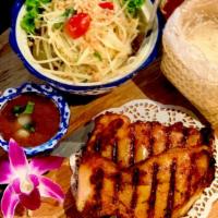 Kai Yang · BBQ chicken with turmeric with peanut papaya salad tamarind dressing & toasted rice dipping,...