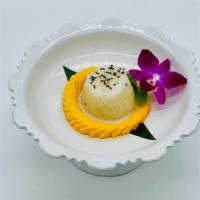 Mango Sticky Rice (Seasonal) · Traditional sweet sticky rice served with mango and coconut cream