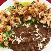Camarones Al Mojo De Ajo · Garlic sauteed shrimp.