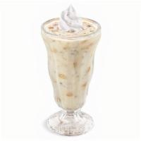 Cookie Dough Milk Shake · Made with premium vanilla ice cream and cookie dough pieces. Topped with whipped cream.