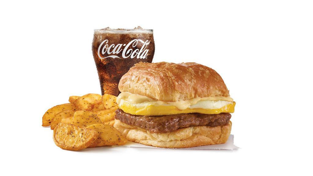Sausage, Egg & Cheese Biscuit Combo · A fresh-cracked grade A egg on a fluffy buttermilk biscuit with grilled sausage and melted American cheese. Meet your new morning favorite.