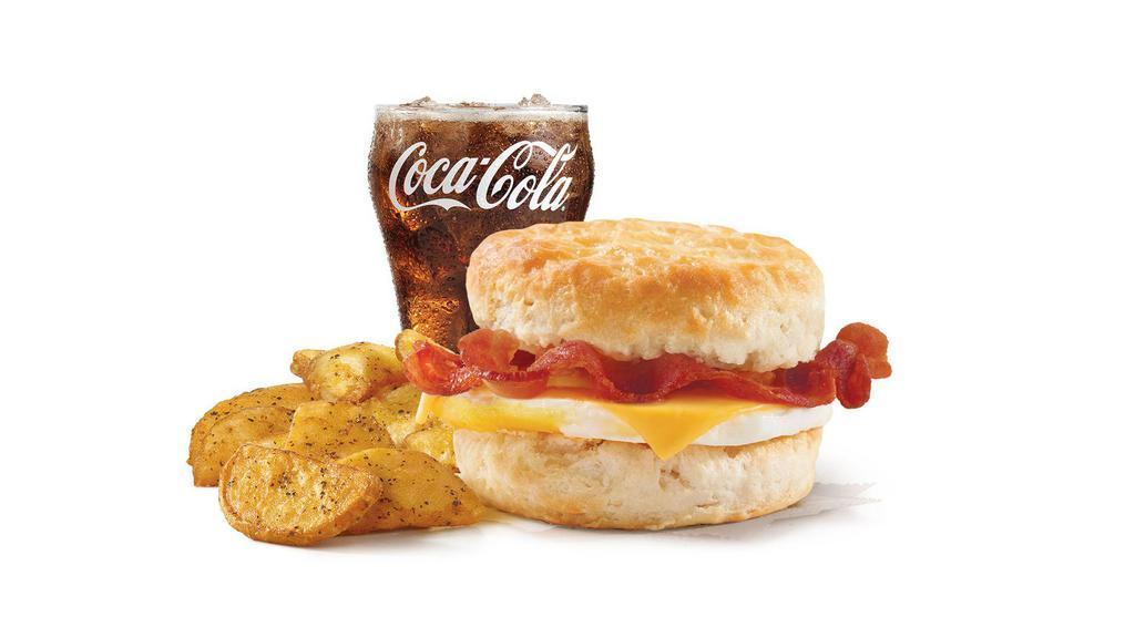 Bacon, Egg & Cheese Biscuit Combo · A fresh-cracked grade A egg on a fluffy buttermilk biscuit with Applewood smoked bacon and melted American cheese. Rise and shine with a hearty favorite.