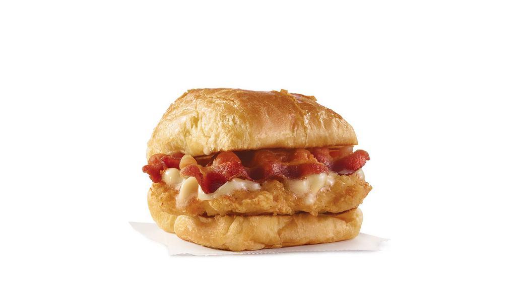 Maple Bacon Chicken Croissant · A juicy chicken breast, Applewood smoked bacon, and maple butter on a flaky croissant bun. A little sweet. A little savory. A lot good.